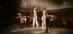Champagne ceiling stilt walkers