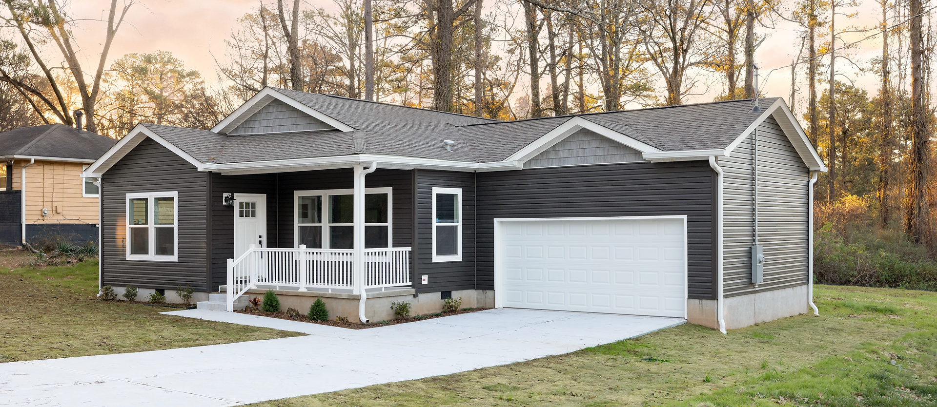 An image of an Omnistruxion Keeneland CrossMod Home newly built on a sizable lot.