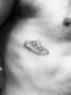 sandal_on_the_ribs_fineline_tattoo