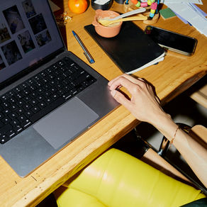 Marketing Professionals Sat at Laptop busy over having lunch at desk