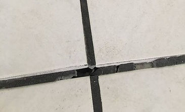 Cracked Grout is caused by tile pressure nd can be ixed by tile injection