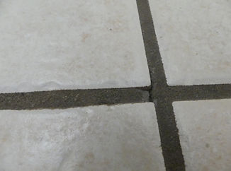 Cracked, loose and crumbly grout