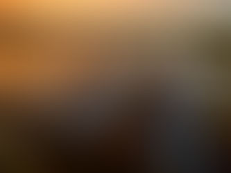 Rows of solar panels installed over water at sunset, forming a large-scale solar farm.