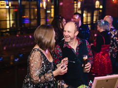 Janie and Dale of The Lucky Sixpence at a glitter bar at alternative wedding industry awards night