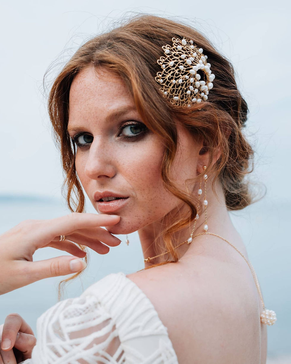 Thumbnail: modern layered pearl bridal earrings which hang from the front and back of the ear - available in two lengths