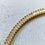 Thumbnail: close up of rhinestone bridal headband in gold