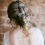 Thumbnail: bride wearing everlasting baby's breath gypsophila hair pins dotted through a boho braid bridal updo
