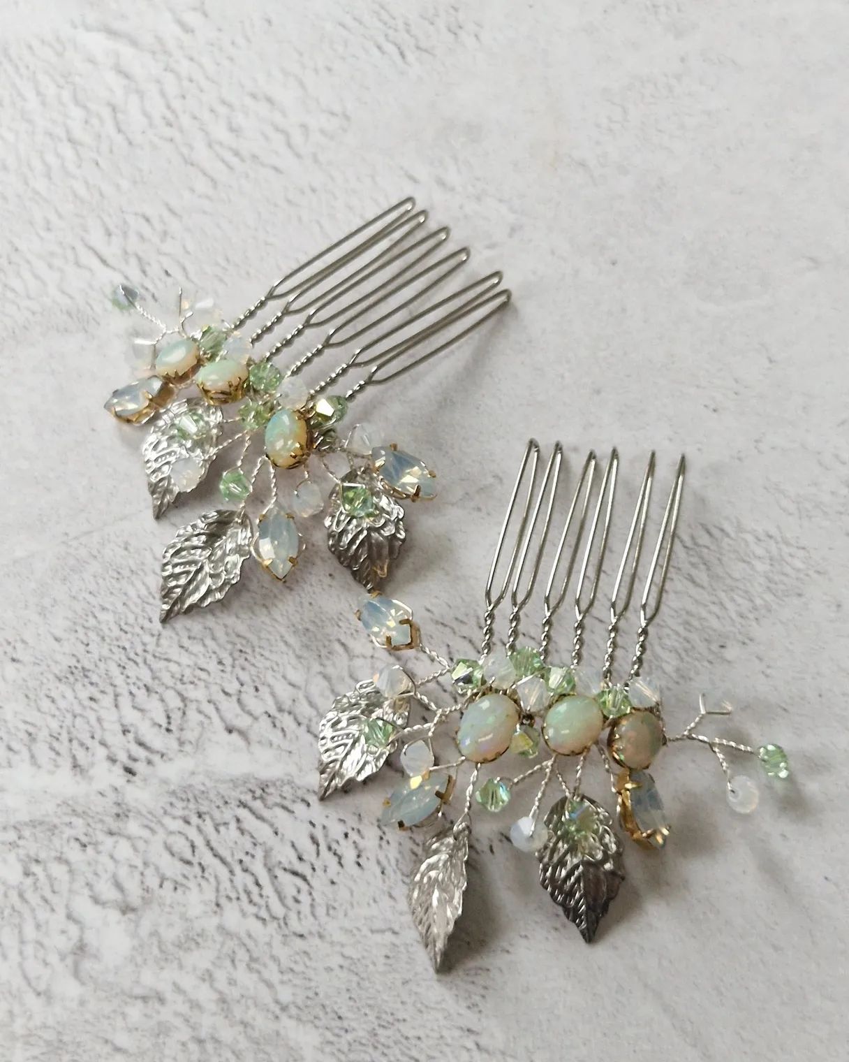 a trio of bridal combs made with reworked preloved vintage opals from the clients grandmother