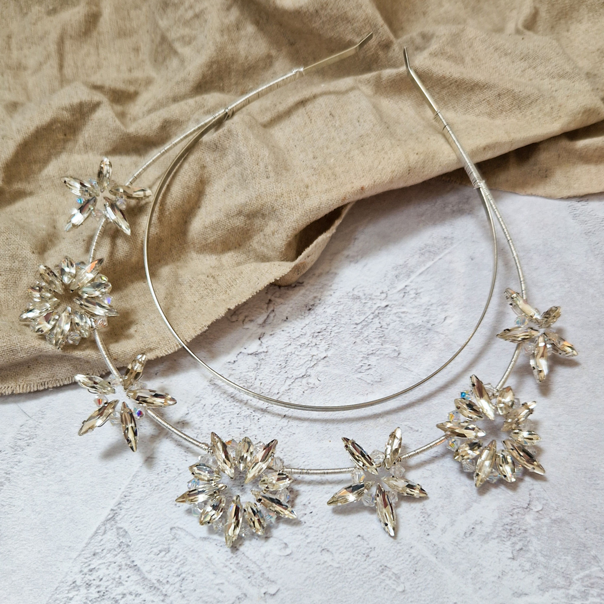 glistening silver, gold or black stars hover around the head on this handmade star crown. Perfect for alternative brides