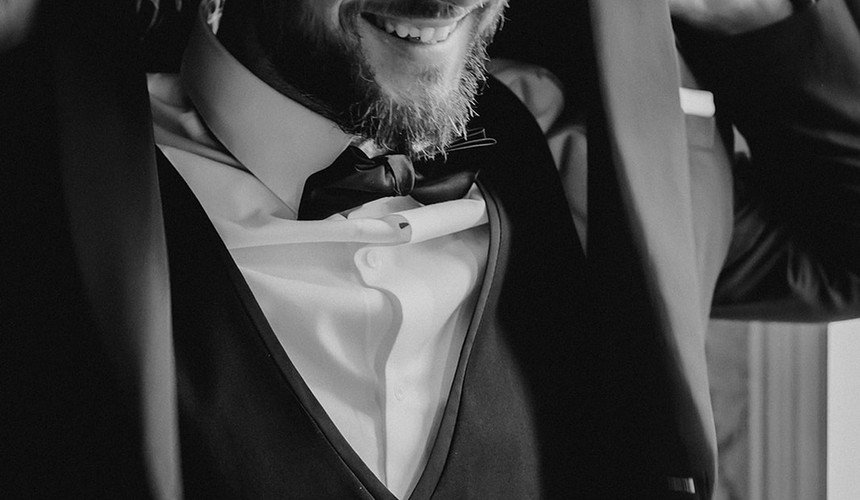 groom getting ready for his personal and sentimental wedding day