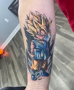 Color anime Goku Dragon Ball tattoo on arm by Tattoo Nation in Bowie MD