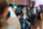 Woman with VR headset on looking surprised