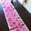 Thumbnail: Table Runner Pink embroidered on natural cotton fabric