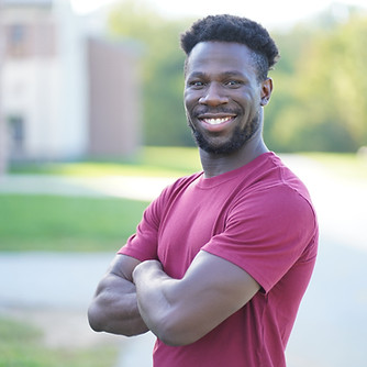 Headshot of Ola, the lead photographer, with a smile.