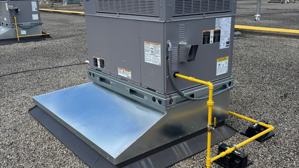 Rooftop unit replacement by crane at a commercial plaza (photo 2)