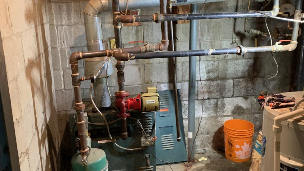 High-efficiency boiler replacement in a basement mechanical room (main photo)