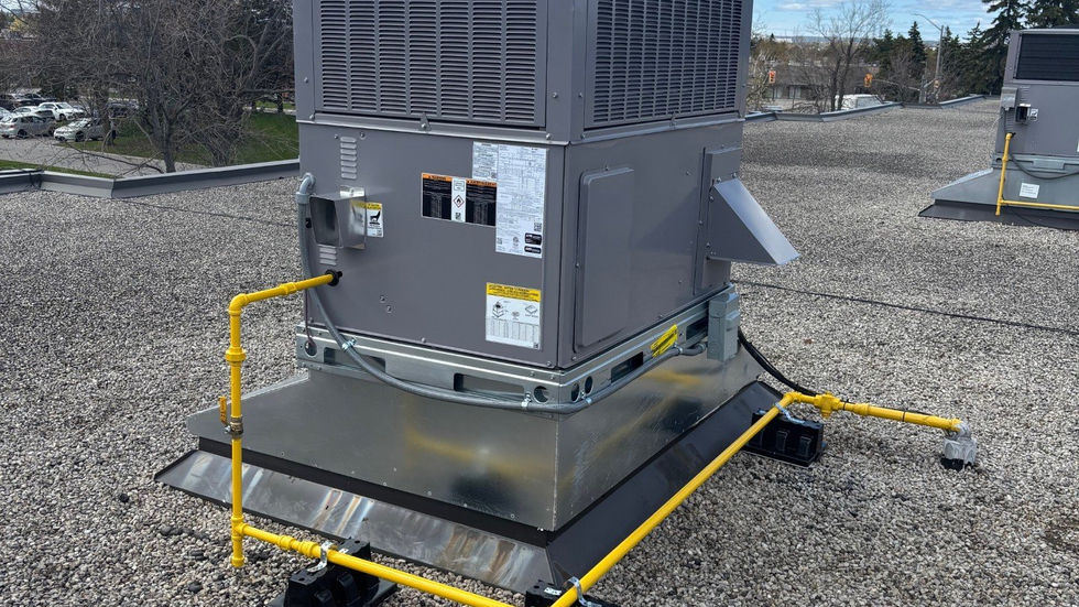 Rooftop unit replacement by crane at a commercial plaza (photo 1)