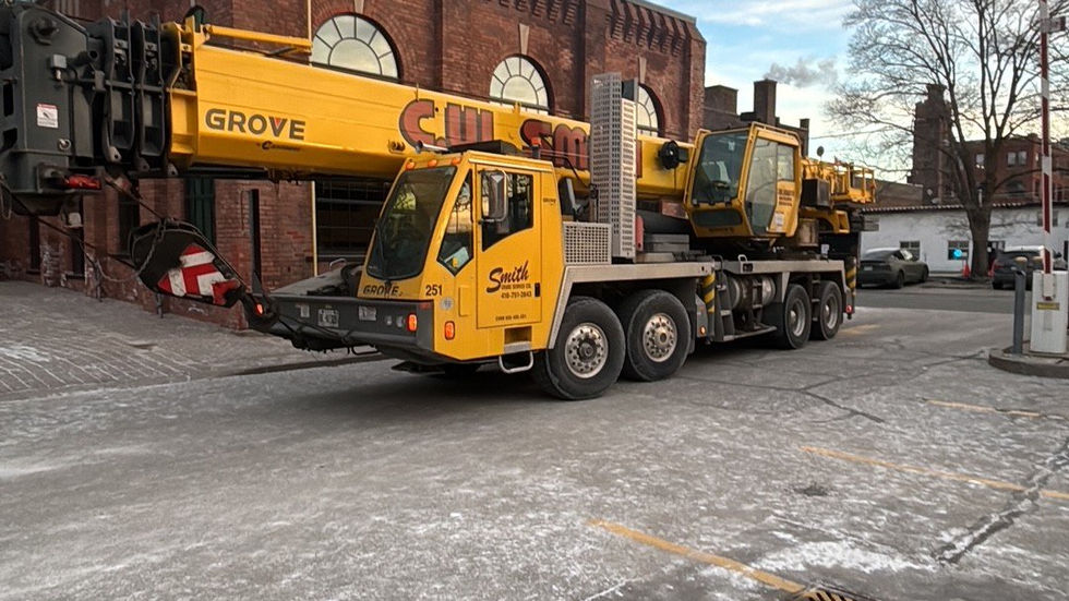 Large rooftop air-handling unit set by mobile crane on a heritage brick building (photo 12)