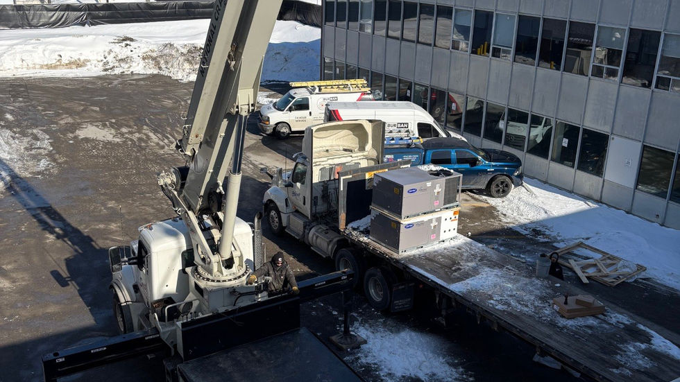 Winter rooftop unit replacements by crane (photo 2)