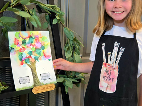 Children painting together during an art lesson at a San Diego art studio