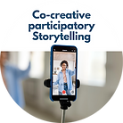 A person in the screen of a smartphone on a selfie stick