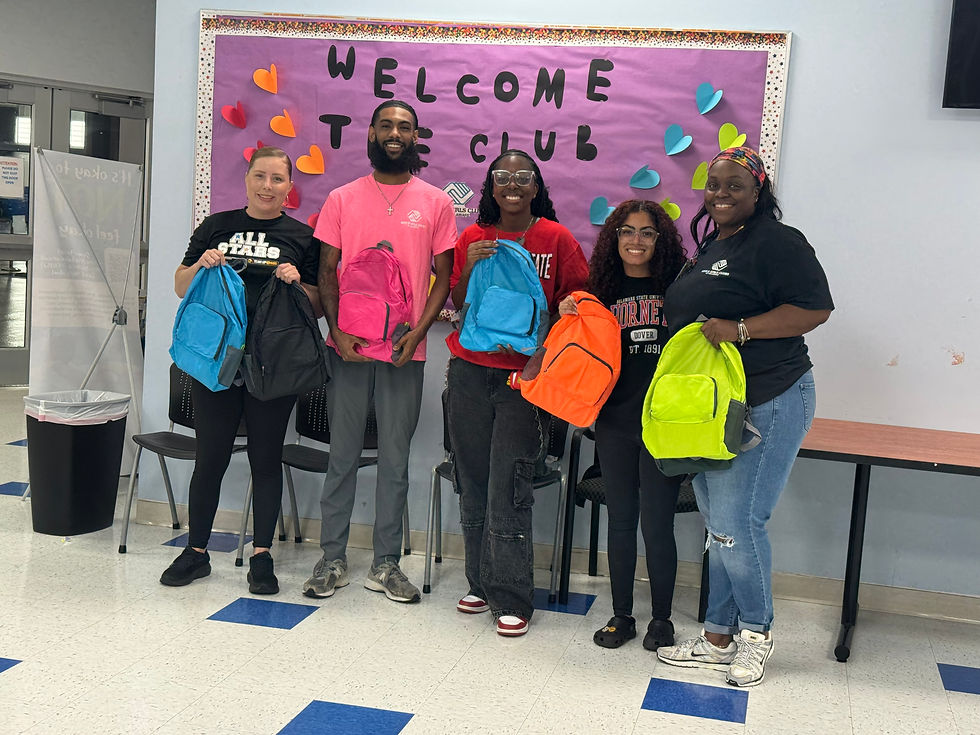 Adasia with staff at the Greater Dover Boys & Girls Club