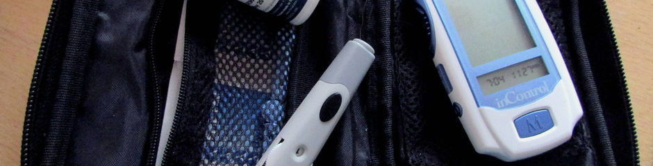 A black case with diabetes testing supplies inside.