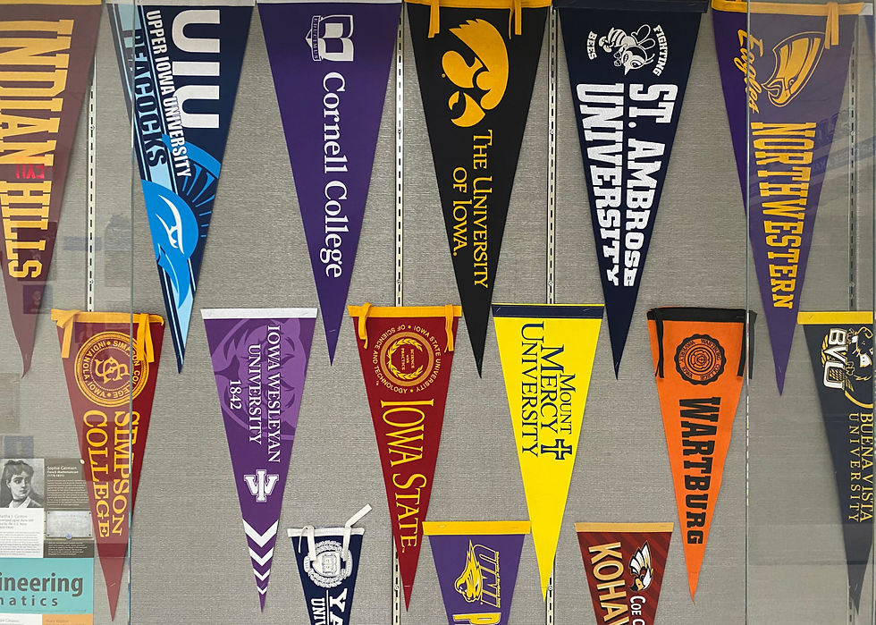 COLLEGE PENNANTS IN THE CCAHS TROPHY CASE; PHOTO BY JESSE SCHUERER