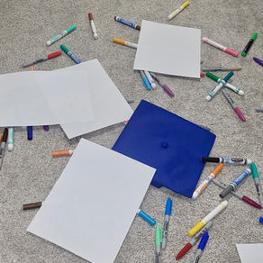 Graduation cap and art supplies
