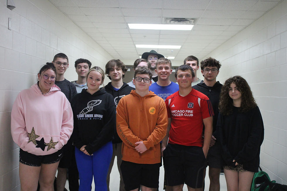 Group of senior section leaders posing outside the band room.