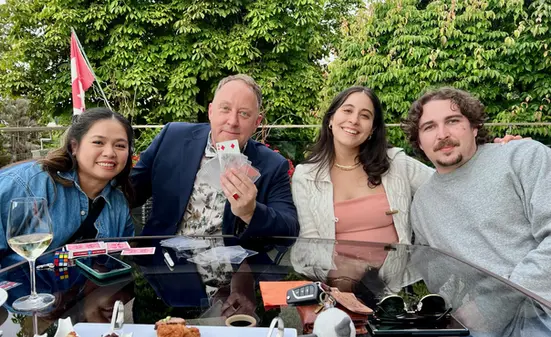 Vancouver house party magician Bro Gilbert performing close-up magic for guests at a private home gathering