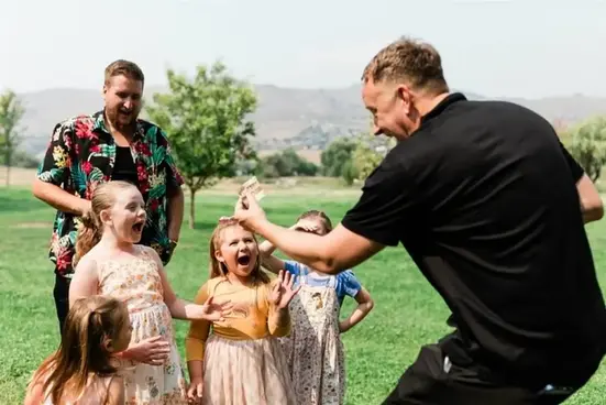 Vancouver private party magician Bro Gilbert performing close-up magic for guests of all ages at a milestone birthday celebration