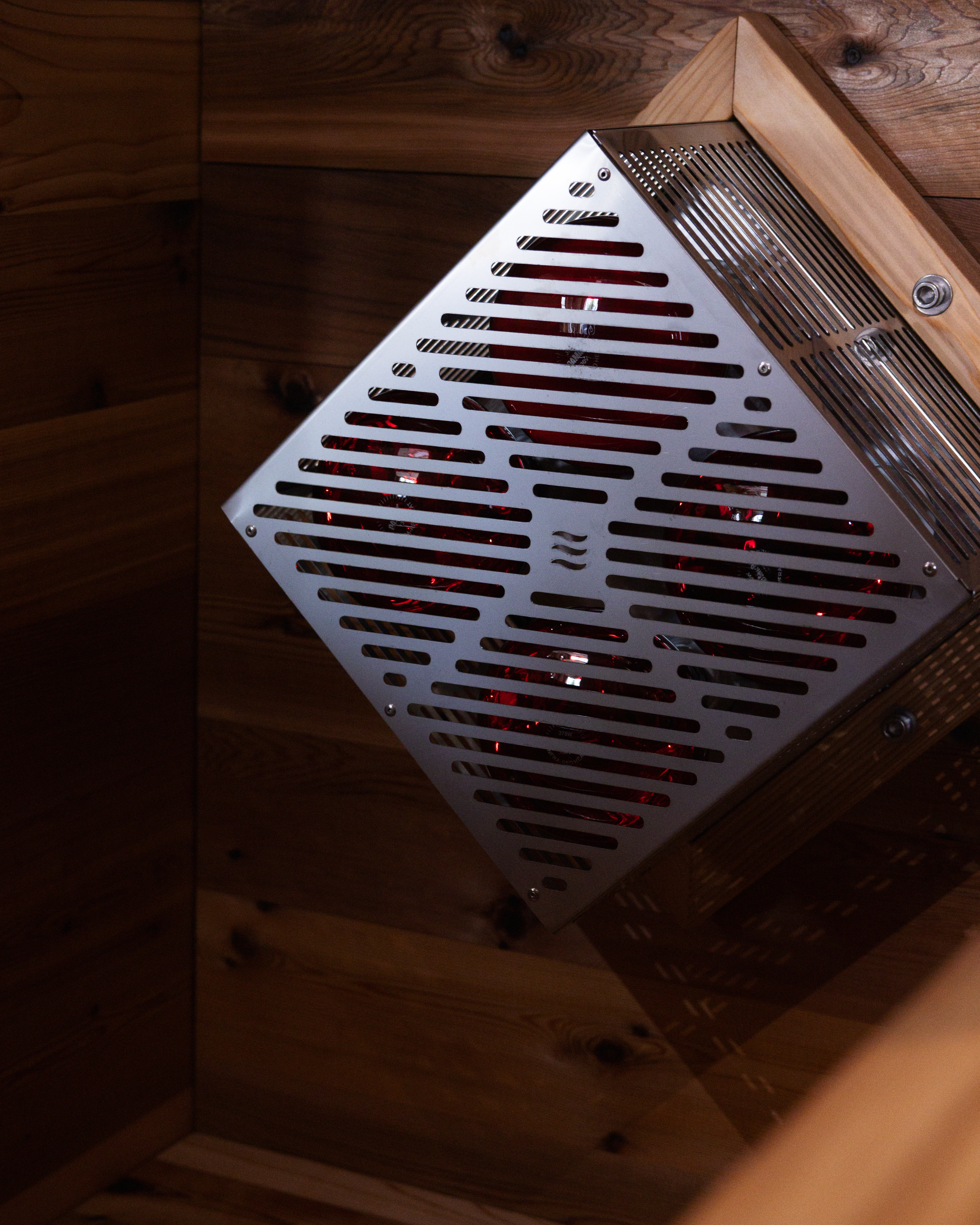 Close-up of the diamond-shaped heater grille inside a Hot Box Sauna cabin