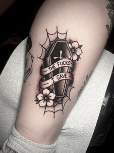 coffin and flowers tattoo