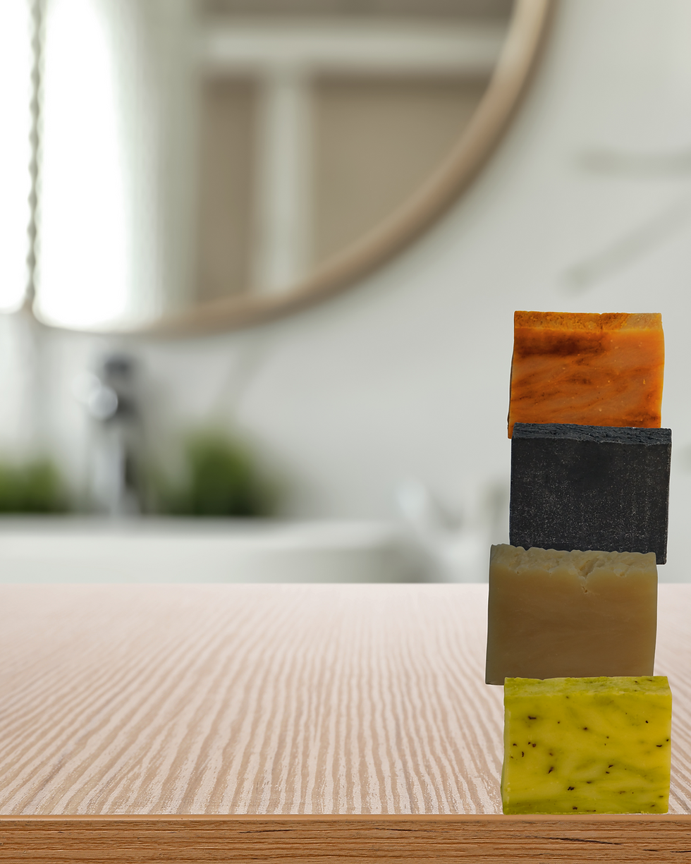 Close-up view of organic skincare bottles on wooden surface
