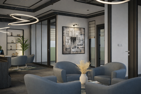 Modern office lounge with soft seating, sculptural pendant lighting, glass partitions, and neutral finishes.