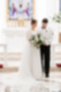 Bride and groom at altar in cathlic church