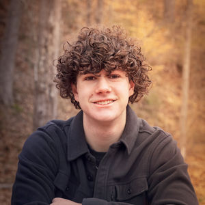 High school boy outside smiling at the camera