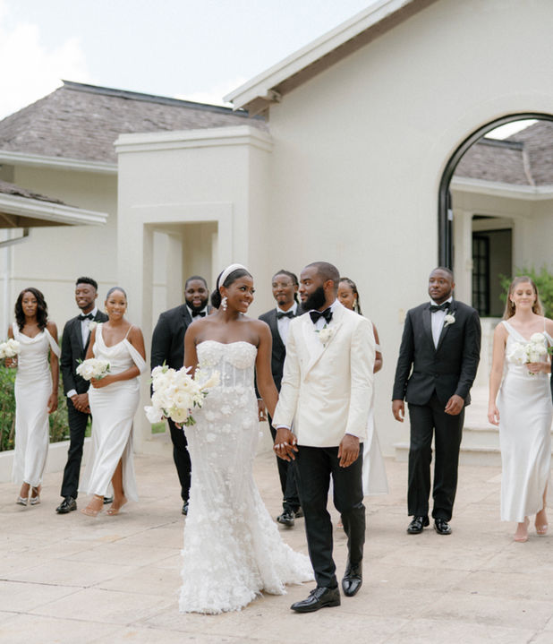 Newly-weds poses for their photographer at their destination wedding in Jamaica
