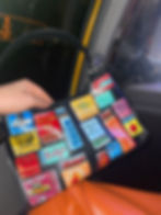Bold hand painted leather purse featuring iconic NYC venues of matchboxes. Showcasing colorful and trendy matchbook art. Sale