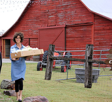 Melody Dockery setting up her floral arrangements at a wedding