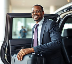 African American chauffeur loading lugg