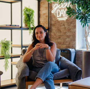 Woman calmly thinking about her budget at home in a relaxed environment