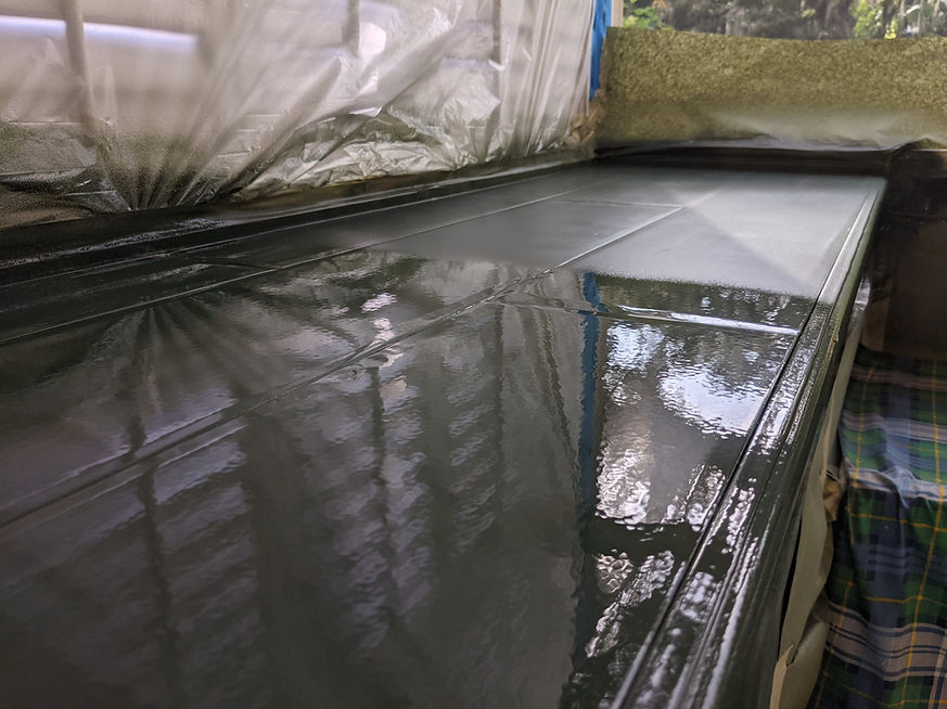 spraying finish on a cabinet top