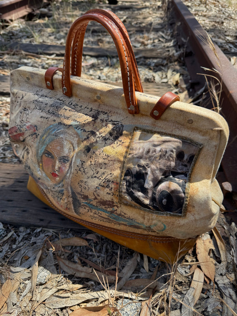 one-of-a-kind Fly Art Atelier travel case with faded typography and cinematic artwork