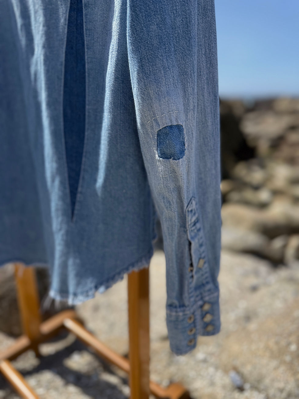 Thumbnail: Visible mending sleeve repair on handmade denim shirt