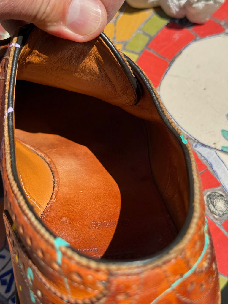 Thumbnail: Interior view of leather Oxford shoes showing craftsmanship and wear
