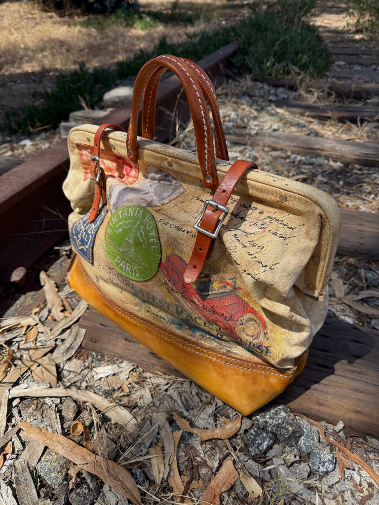 hand painted vintage travel valise with romantic European imagery and railway inspired details