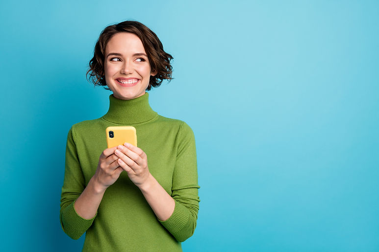 Portrait of positive cheerful girl use smart phone look copyspace share social media news 