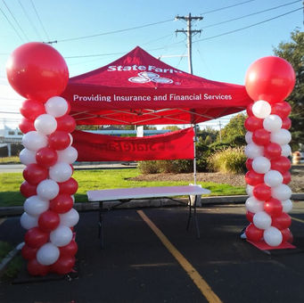 Outdoor balloon columns for State Farm event tent